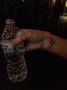A wrist band and sticker wasted on water.